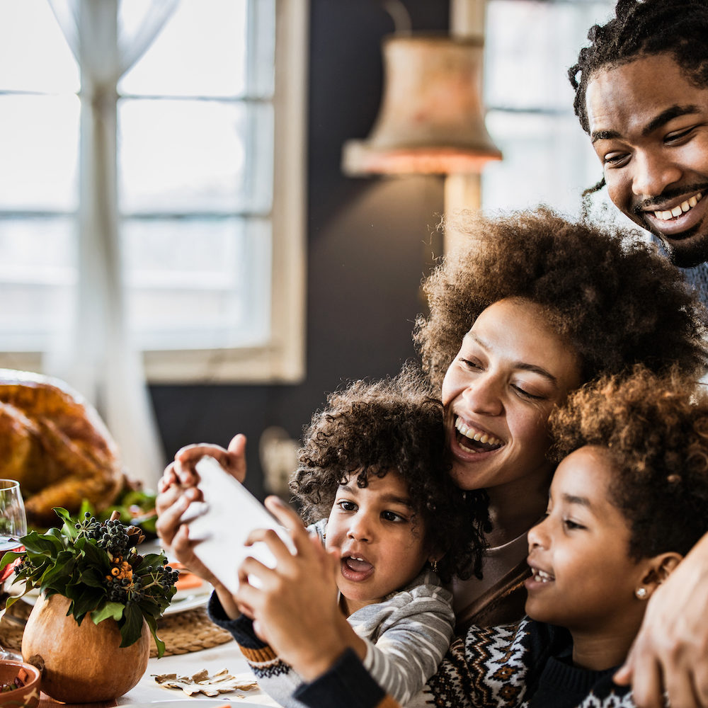 family at table on phone